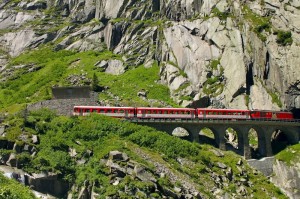 Red Train Goes Through Mountains